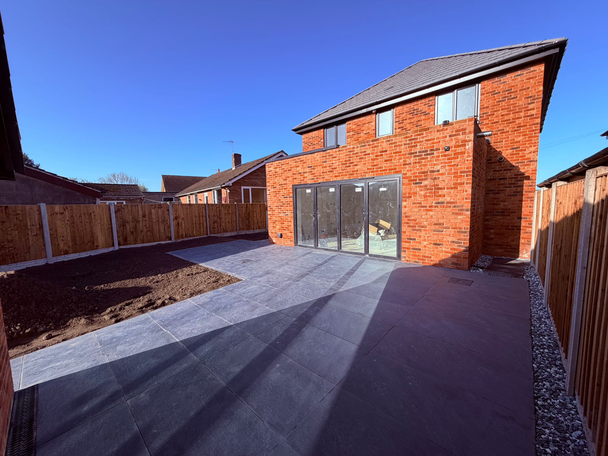 3-bed detached new build with blue sky and finished landscaping