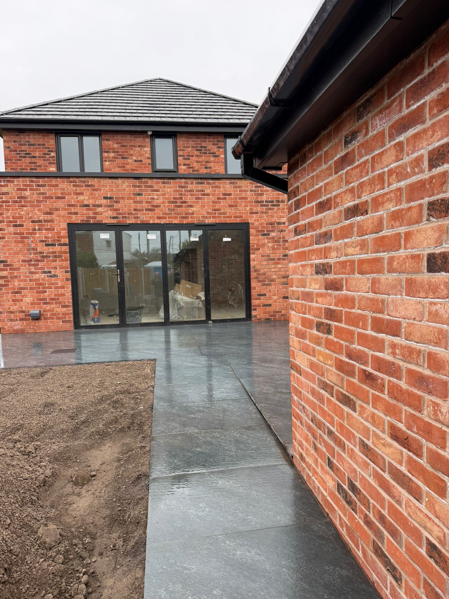 Rear extension with bifolds and grey porcelain patio